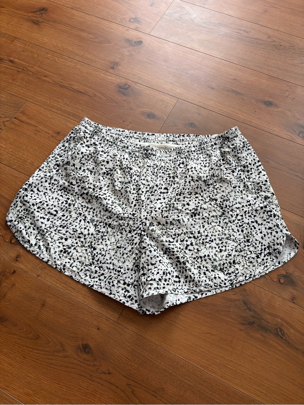 Women's White Athletic Shorts with Green and Black Print